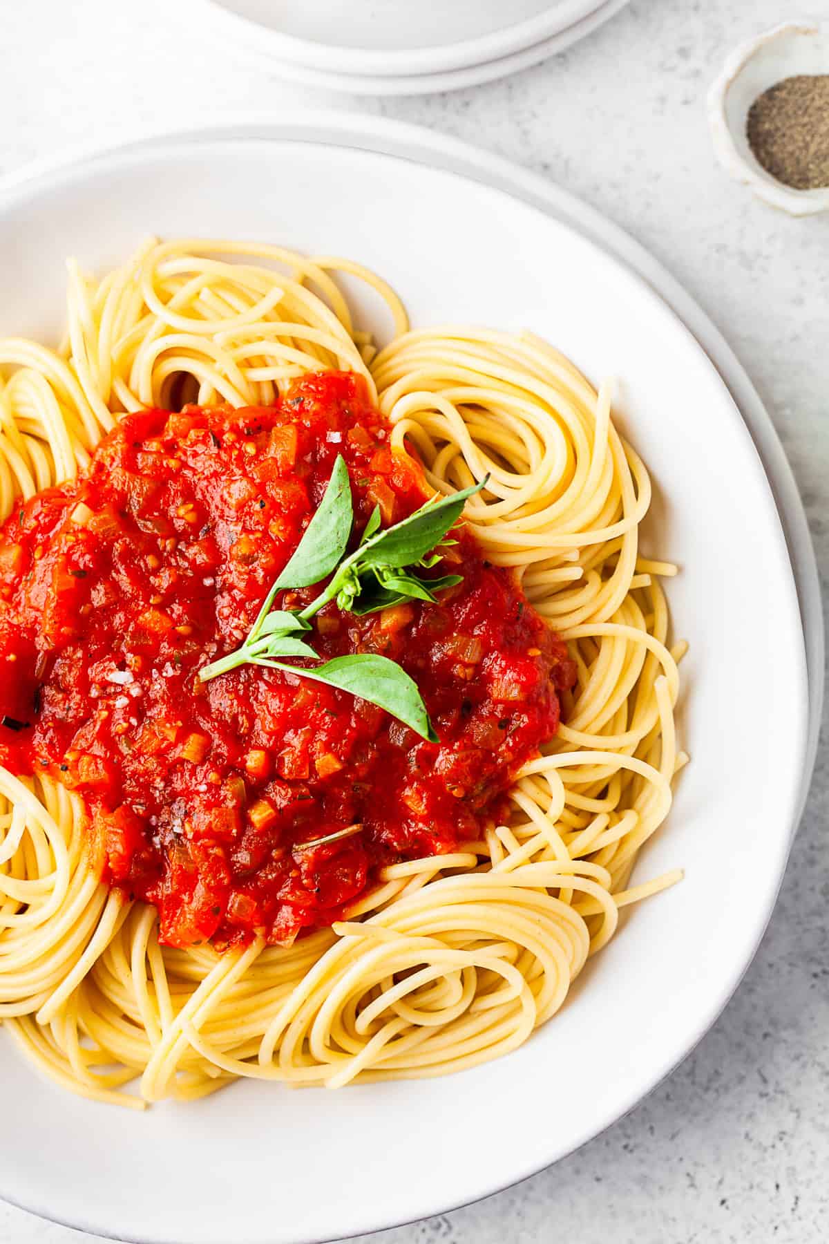Spicy Tomato Sauce spooned over pasta.