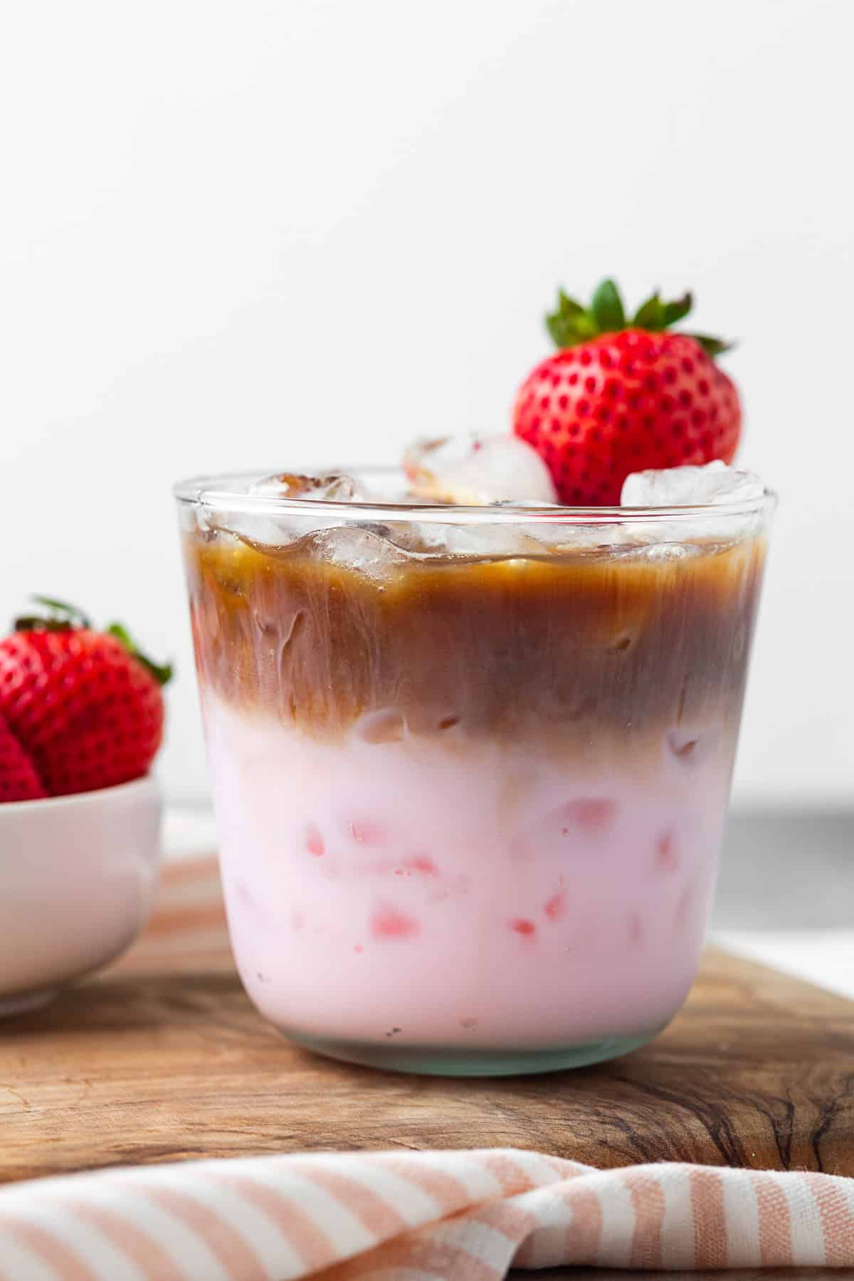 Strawberry milk latte on a table.