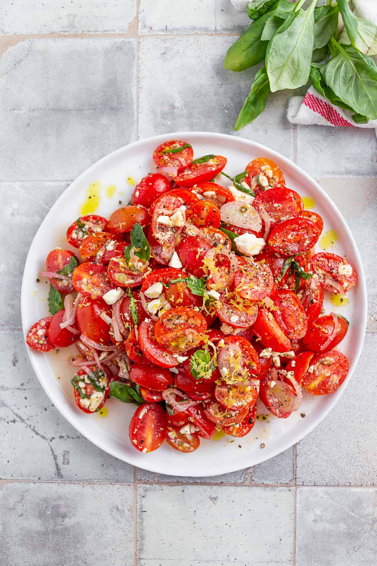 Tomato Salad topped with additional lemon zest.