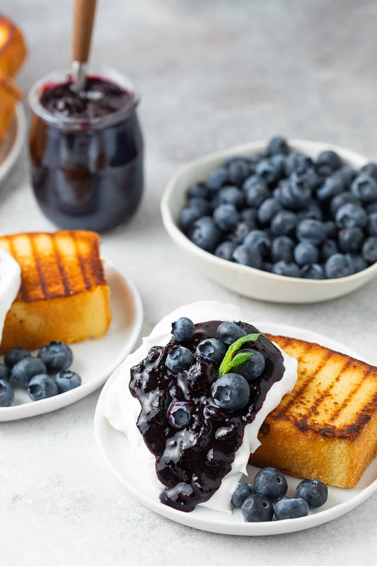 Grilled Pound Cake topped with Cool Whip and blueberry compote.