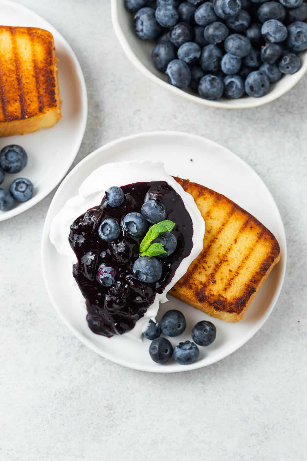 Grilled Pound Cake topped with blueberries.