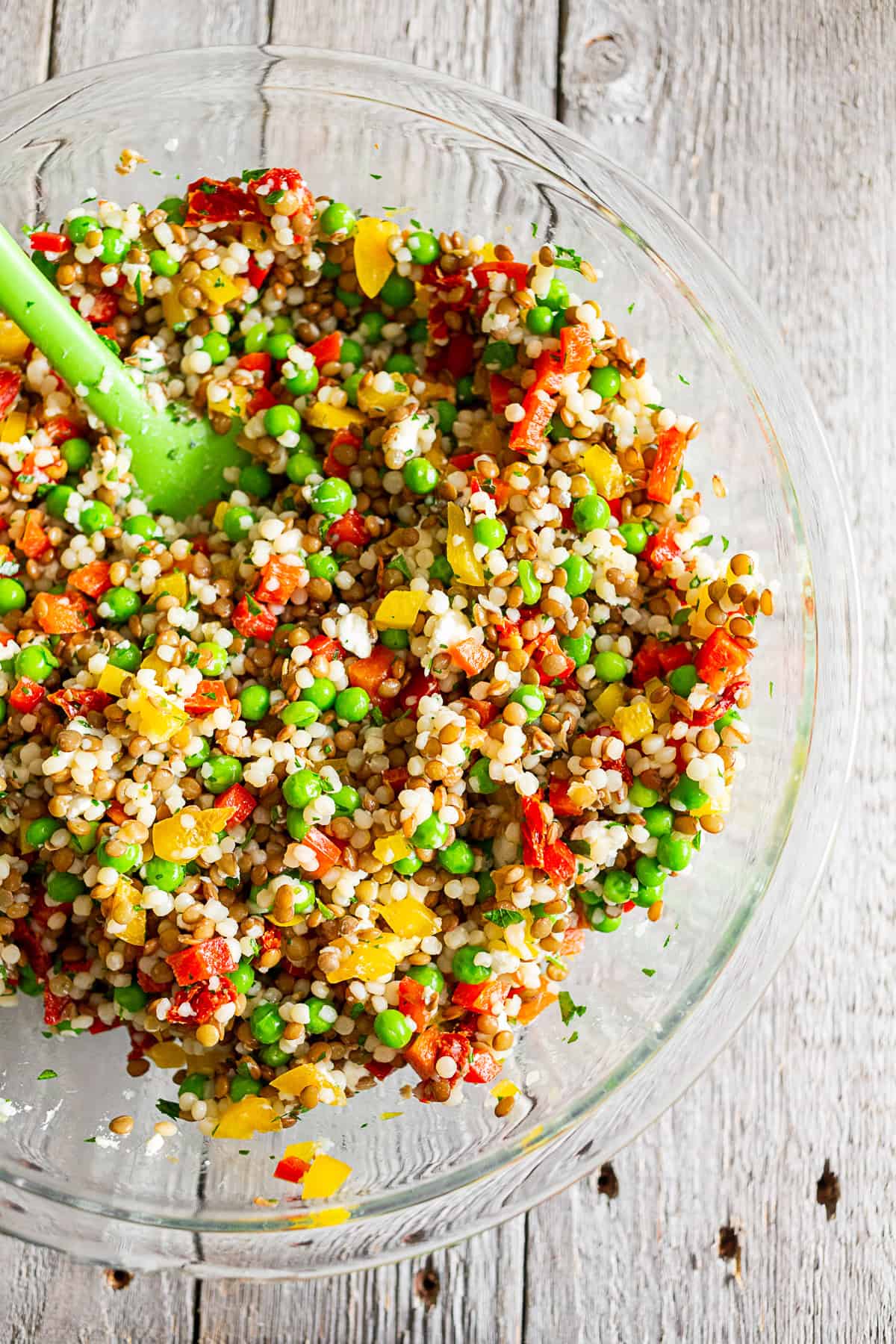 lentil couscous salad in a large glass bowl.