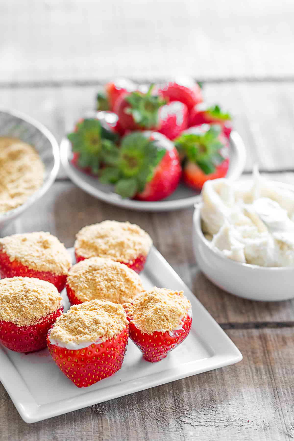 Cheesecake Stuffed Strawberries on a small white plate. 