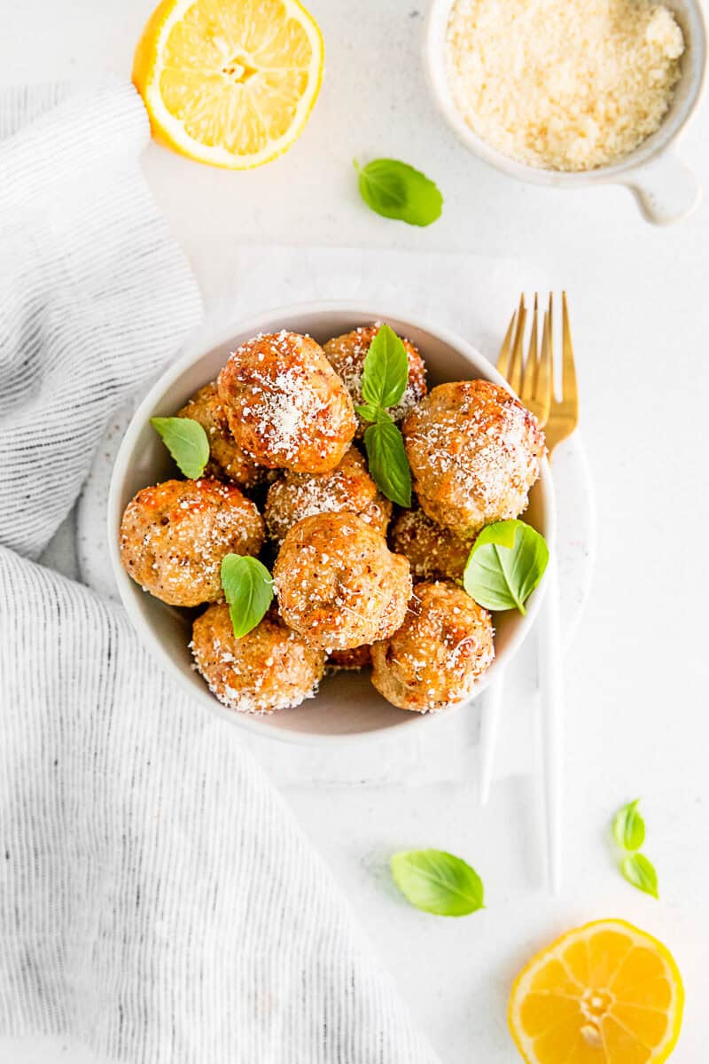 Air Fryer Chicken Meatballs in a white serving bowl. 