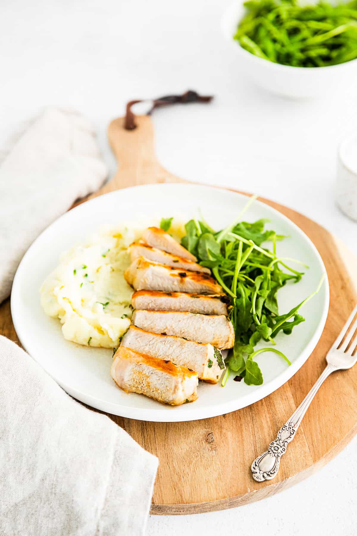 Sliced grilled pork chops on a plate. 