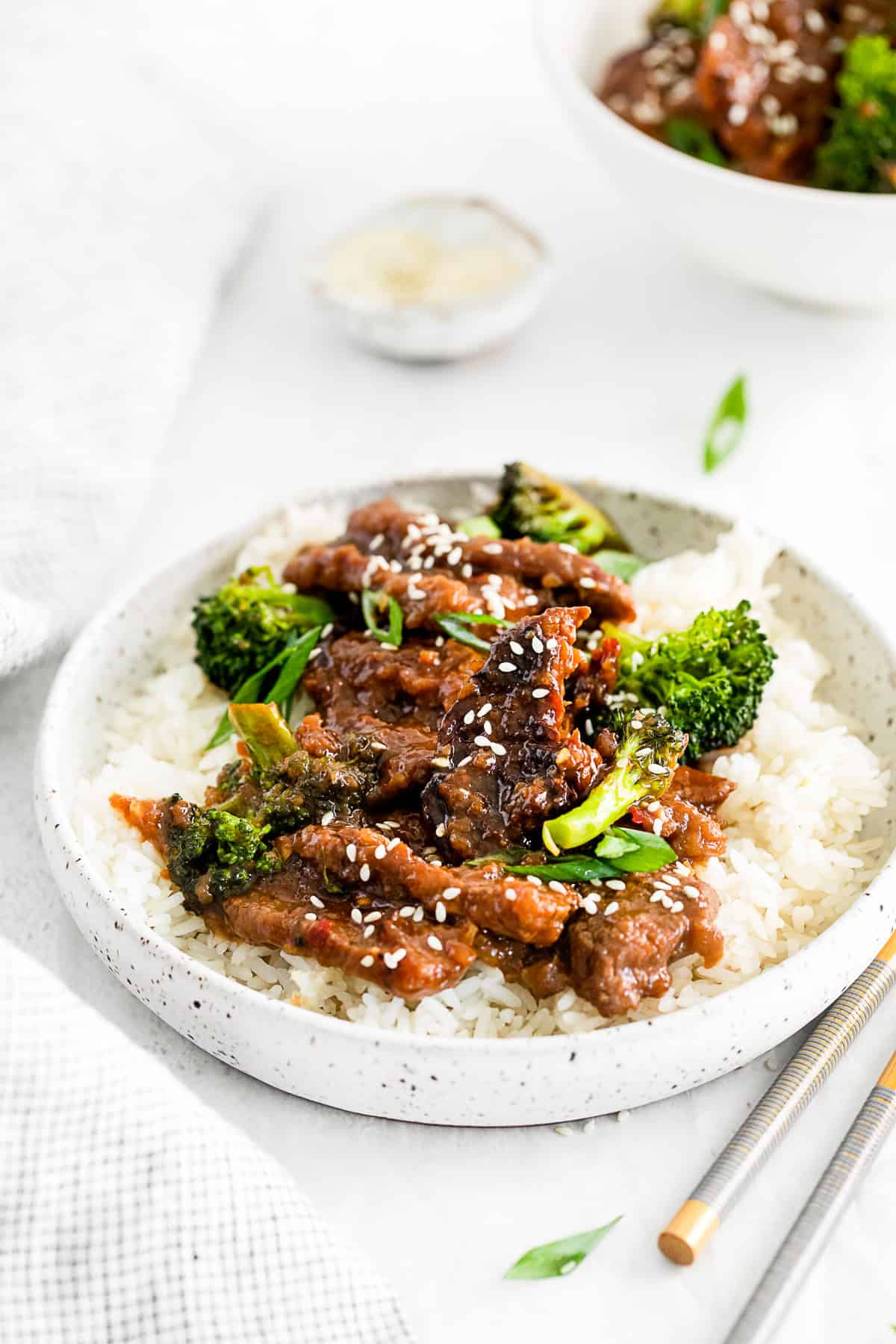 Mongolian beef in a bowl with rice and broccoli. 