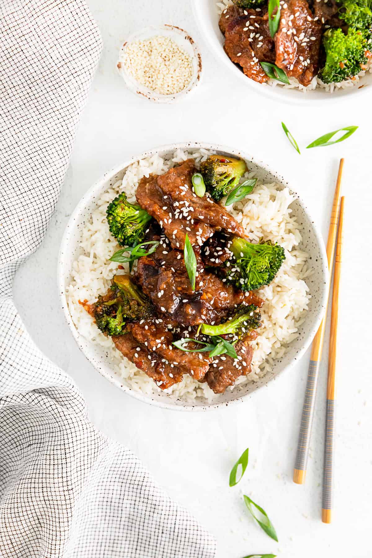 Instant Pot Mongolian Beef in a ceramic bowl served over rice. 