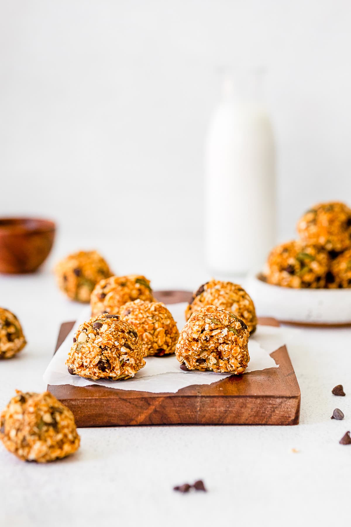 Pumpkin Energy Balls on a table with a bite taken out of it. 