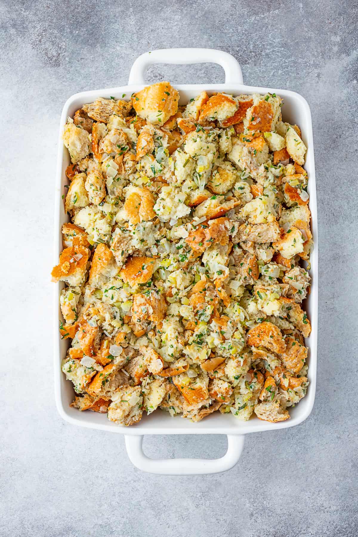 Unbaked Herb Stuffing in a dish. 