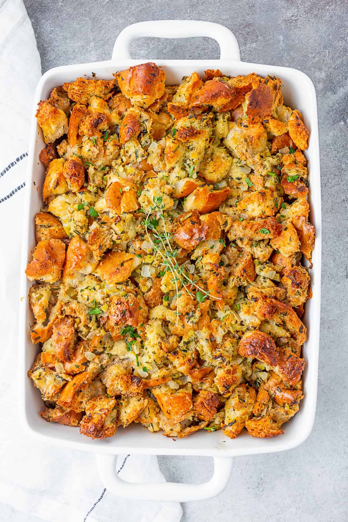 Herb Stuffing in a white casserole dish. 