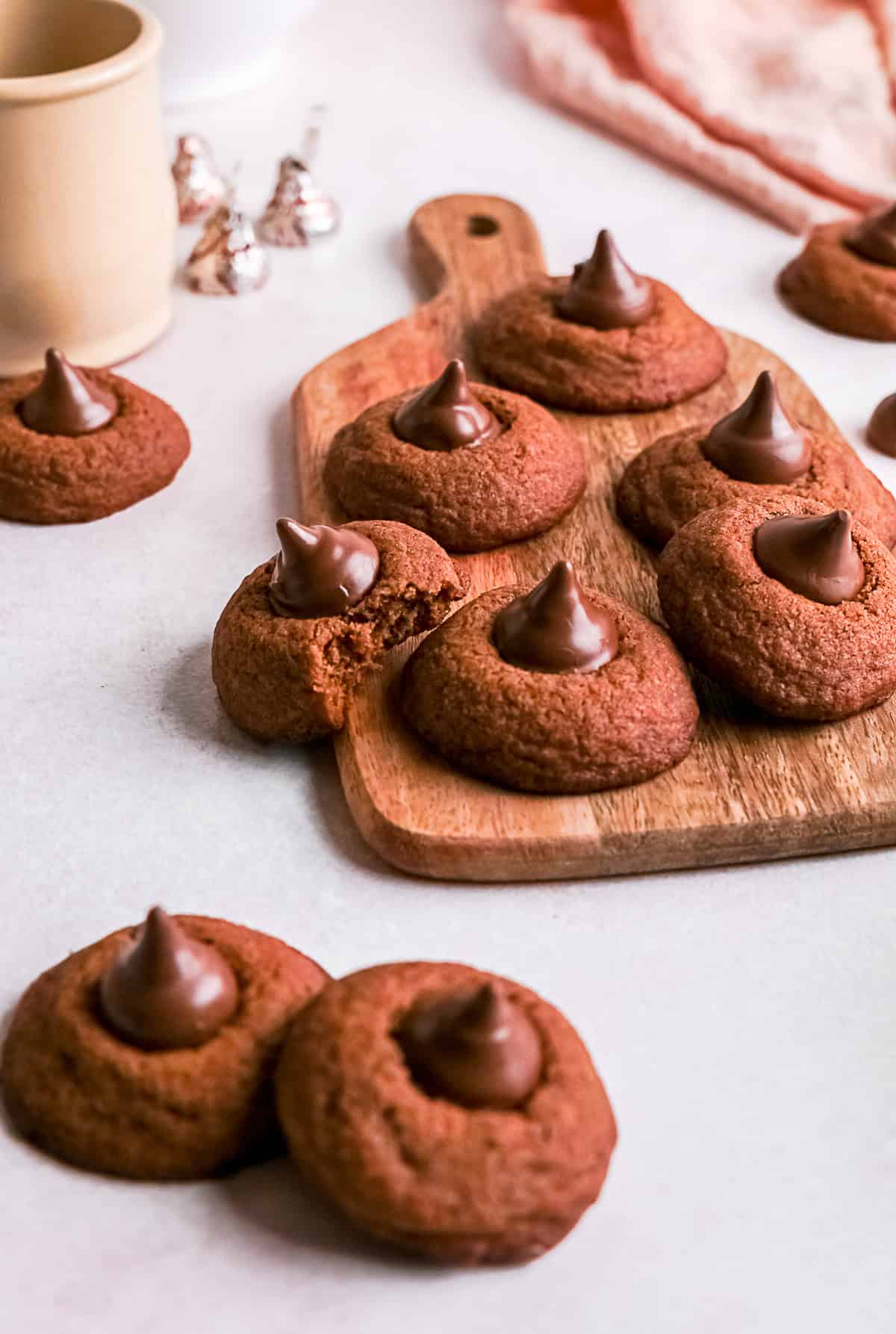 Chocolate Blossom Cookies with a bite taken out them. 