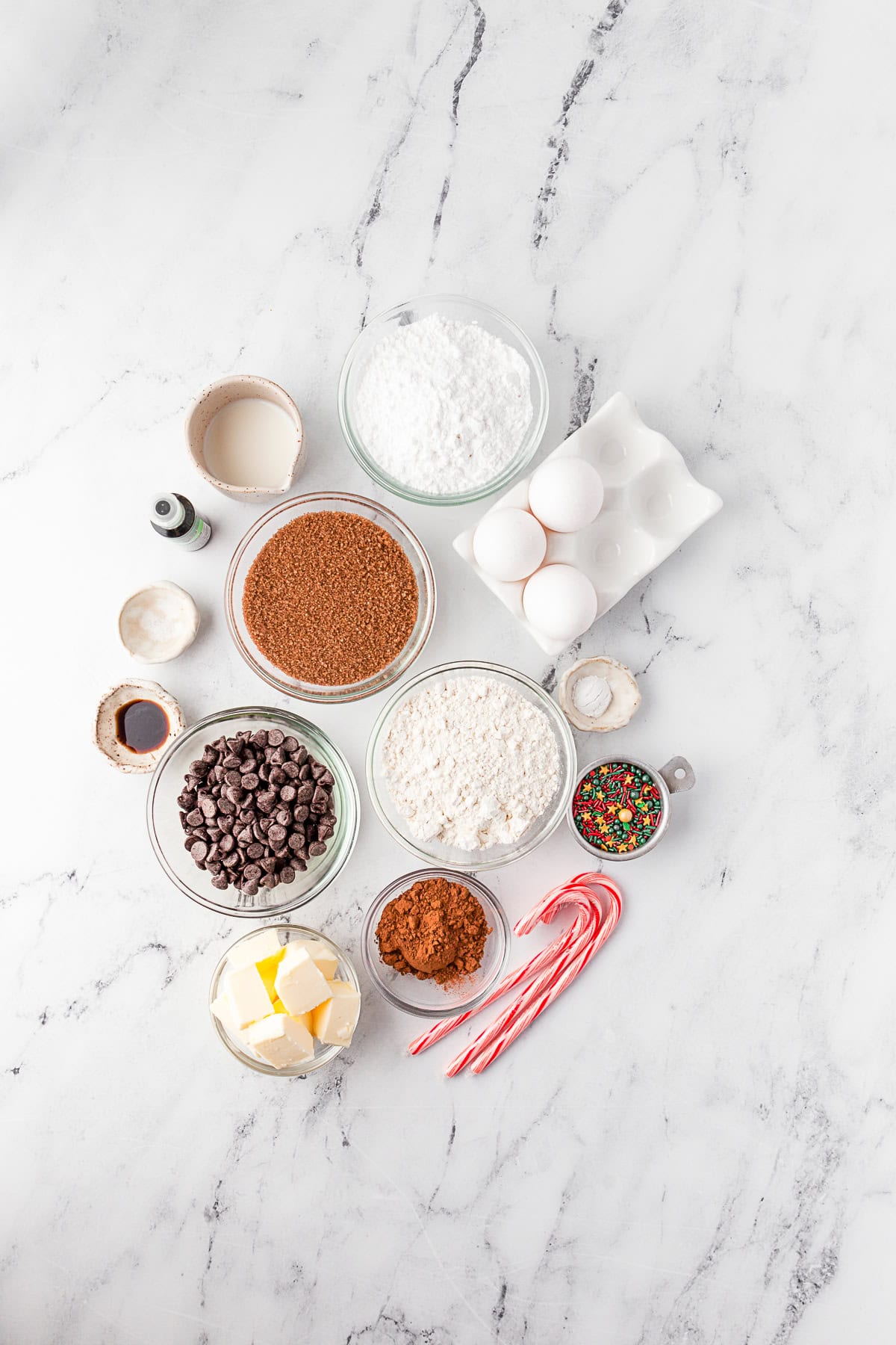 Ingredients to make Christmas Tree Brownies on a marble table. 