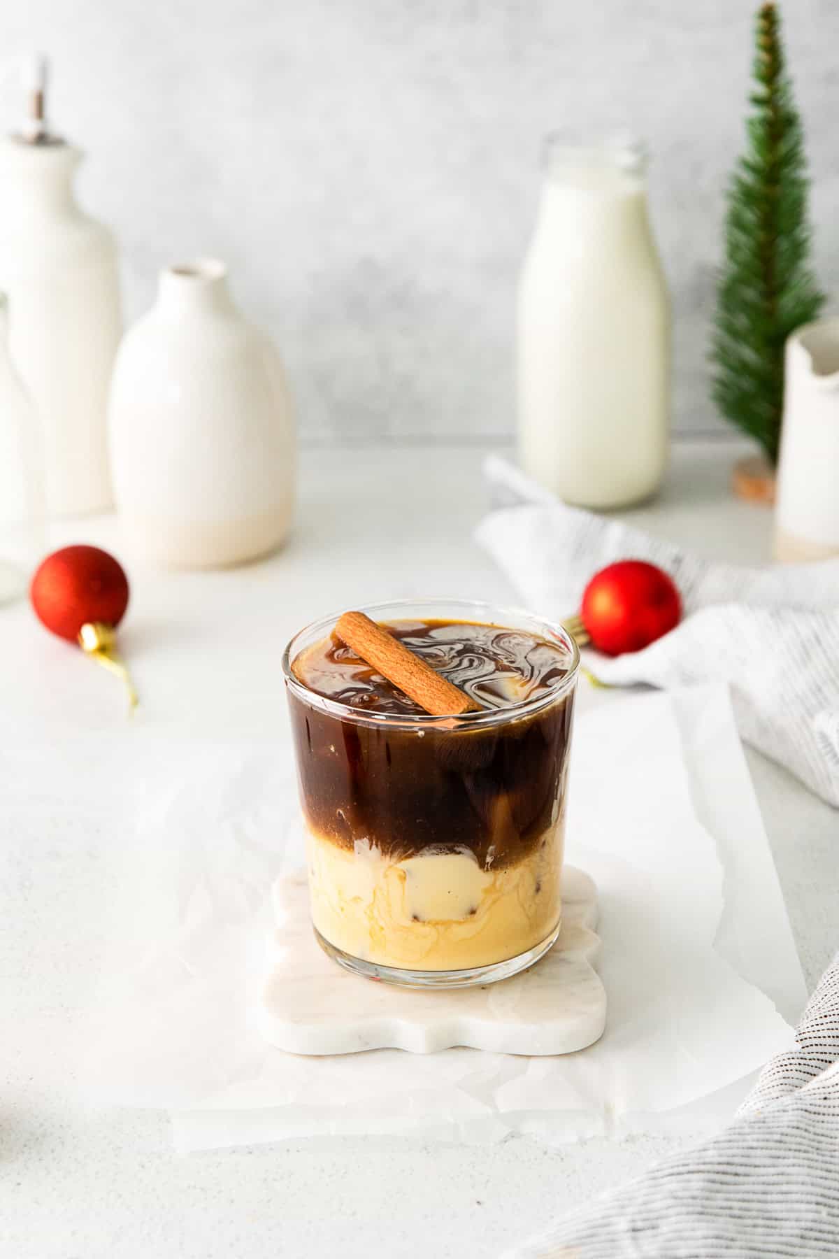 Eggnog White Russian in a cocktail glass with ice. 