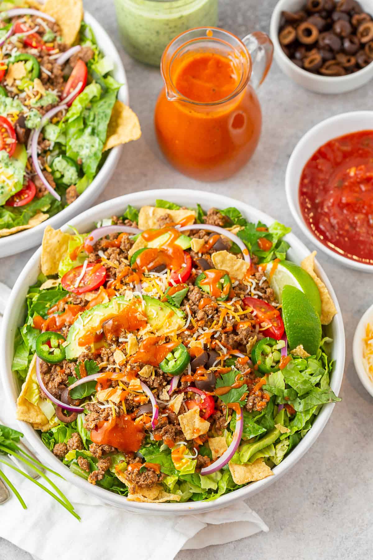 Easy Taco Salad in a bowl topped with Catalina dressing. 